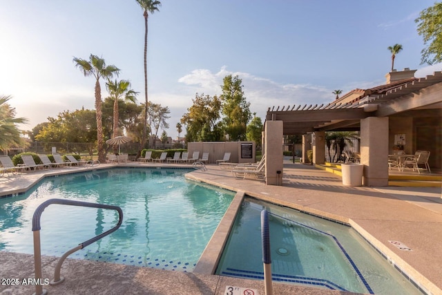 view of swimming pool with a patio area