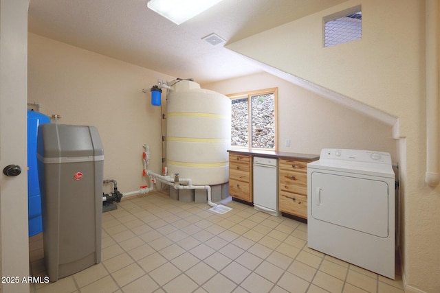 laundry room featuring light tile patterned floors and washer / dryer