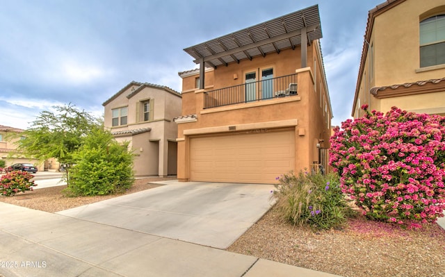 mediterranean / spanish-style house featuring an attached garage, driveway, stucco siding, and a balcony