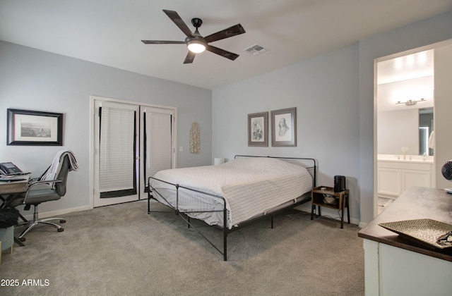bedroom with visible vents, baseboards, a closet, and light carpet