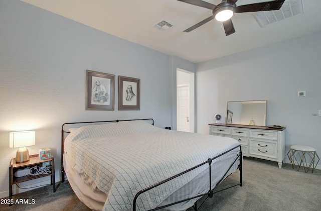 bedroom with baseboards, a ceiling fan, visible vents, and carpet floors