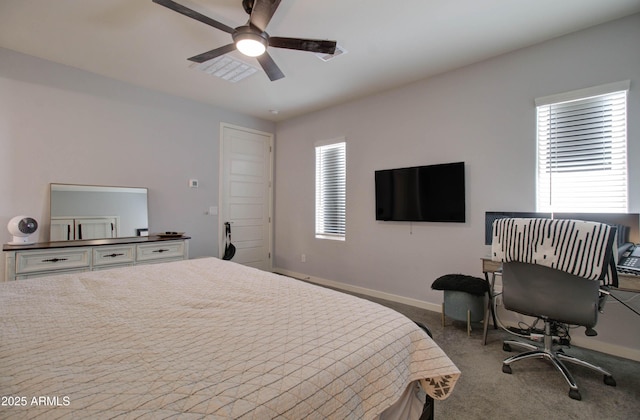 carpeted bedroom featuring visible vents, baseboards, and ceiling fan