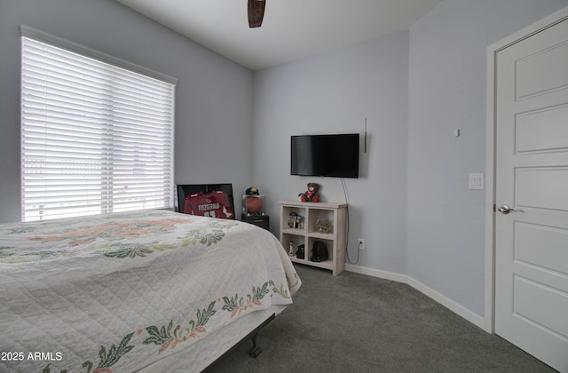 carpeted bedroom with baseboards and ceiling fan