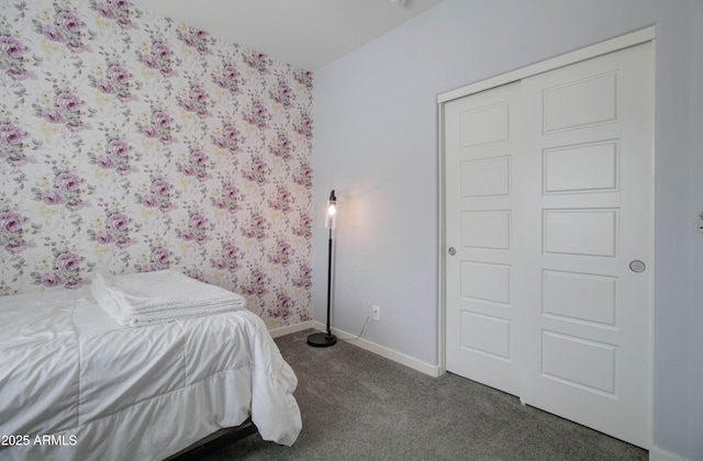 bedroom featuring baseboards and dark colored carpet