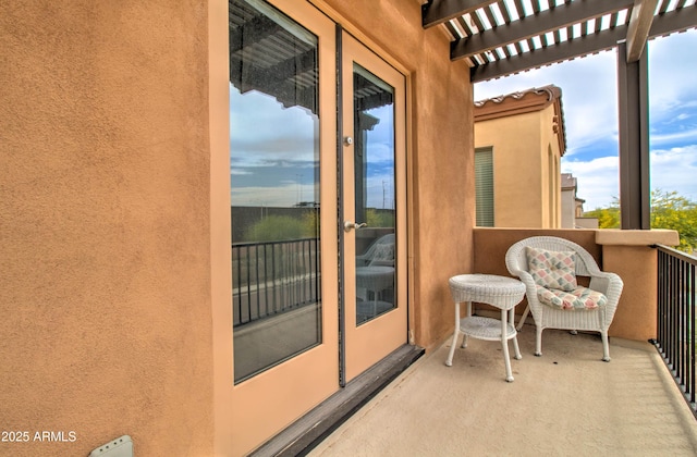 balcony featuring a pergola