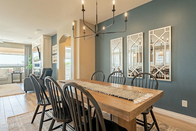 dining room featuring an inviting chandelier and light hardwood / wood-style floors