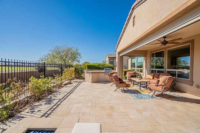 view of patio / terrace with a grill, outdoor lounge area, area for grilling, and ceiling fan