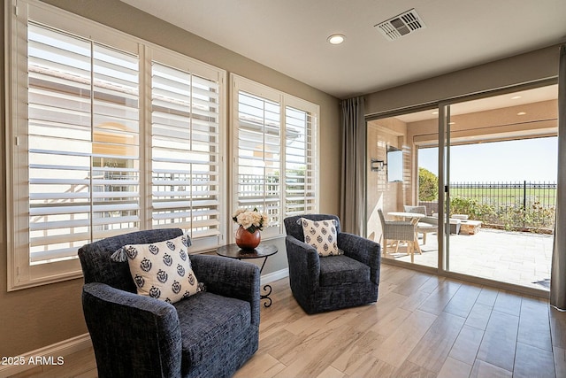 sitting room featuring light hardwood / wood-style floors