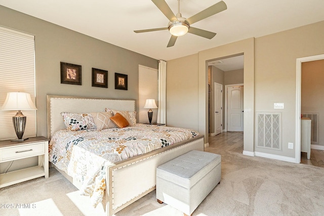 bedroom with light carpet and ceiling fan