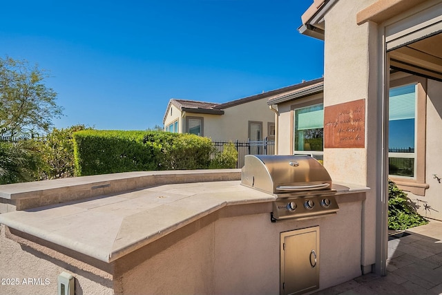 view of patio with a grill and area for grilling