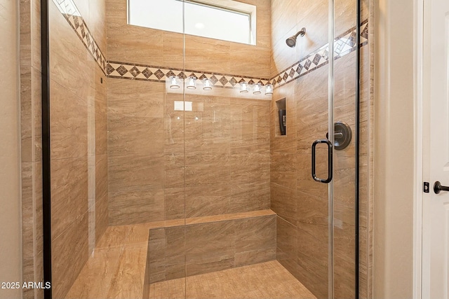 bathroom with a shower with shower door