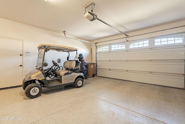 garage featuring a garage door opener