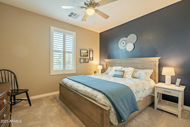 bedroom with light carpet and ceiling fan