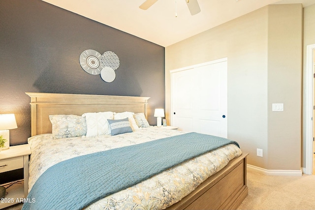 bedroom featuring light colored carpet and ceiling fan