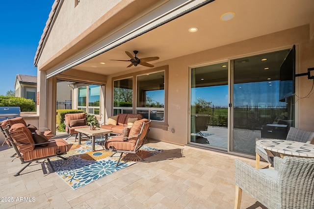 view of patio featuring ceiling fan and an outdoor living space