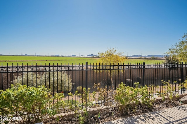 view of yard with a rural view