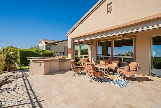 view of patio / terrace featuring grilling area, outdoor lounge area, and an outdoor kitchen