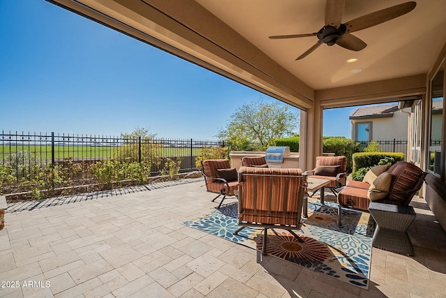 view of patio with outdoor lounge area and ceiling fan