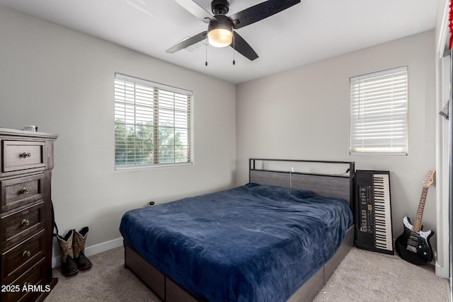 bedroom with baseboards, a ceiling fan, and carpet