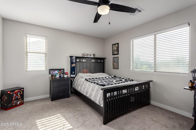 bedroom with carpet, visible vents, a ceiling fan, and baseboards