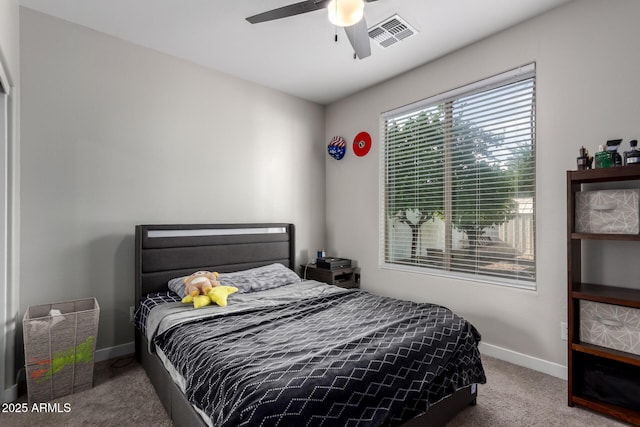 bedroom with carpet, visible vents, baseboards, and ceiling fan