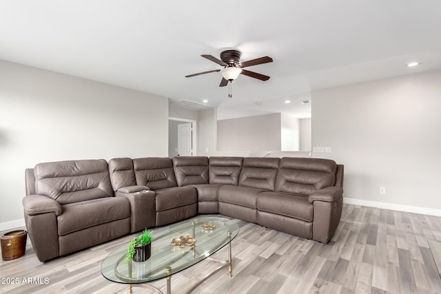 living area with light wood-style flooring, recessed lighting, and a ceiling fan