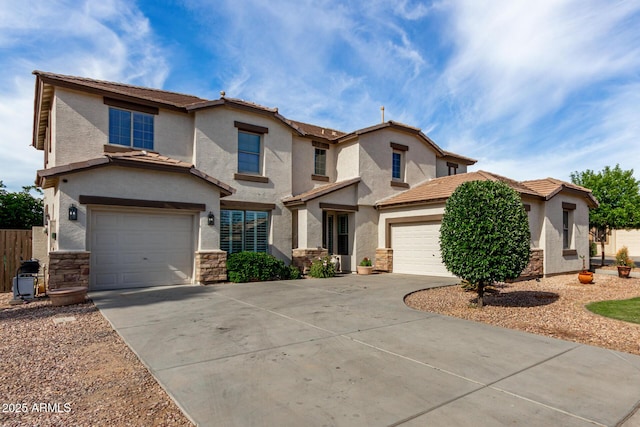 view of front of home featuring stucco siding, stone siding, and concrete driveway