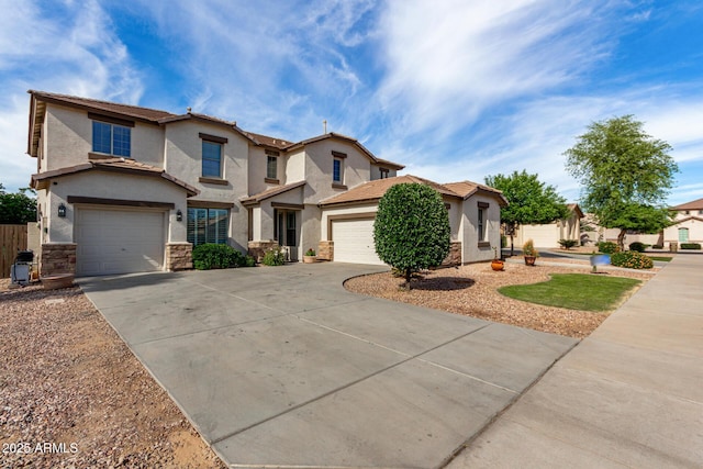 view of front of home featuring stucco siding, driveway, fence, and stone siding