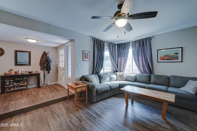 living room with dark wood-type flooring and ceiling fan