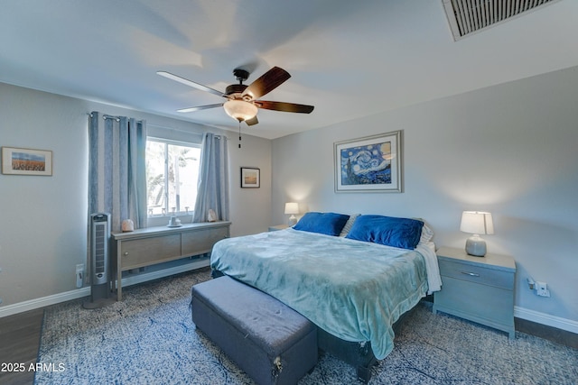 bedroom with dark wood-type flooring and ceiling fan