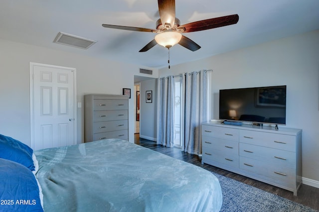 bedroom with ceiling fan and dark hardwood / wood-style floors