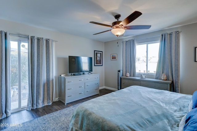 bedroom with ceiling fan and dark hardwood / wood-style flooring