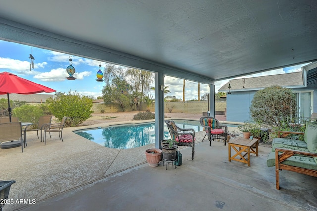 view of swimming pool with a patio area