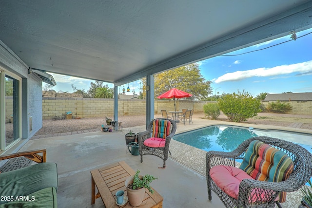 view of patio with a fenced in pool