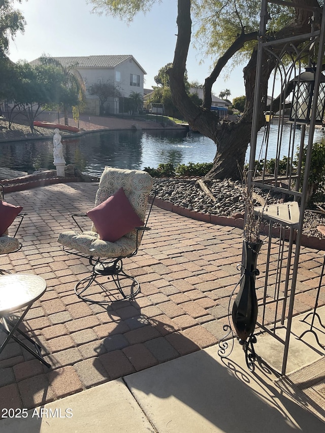 view of patio / terrace with a water view