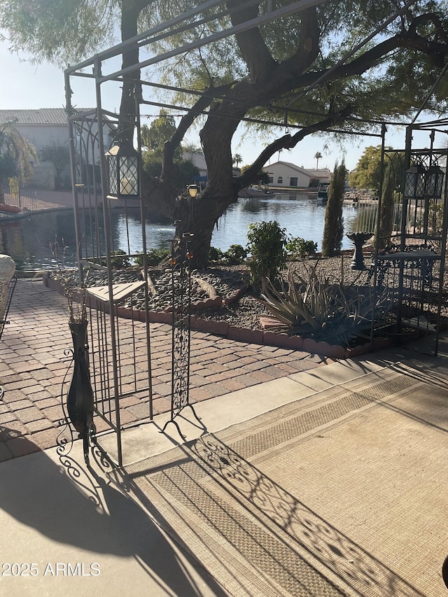 view of patio / terrace featuring a water view