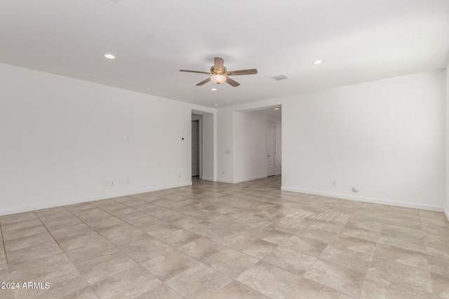 spare room with ceiling fan