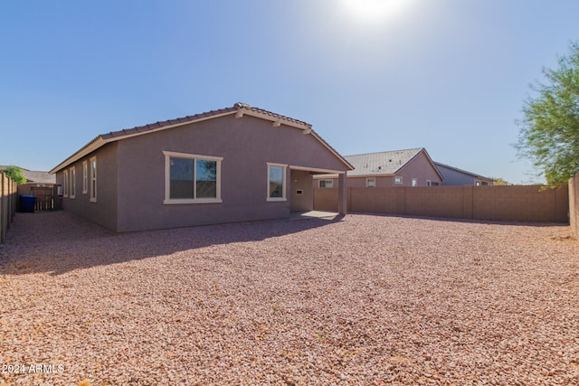 rear view of property with a patio area