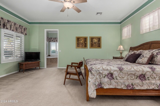 bedroom with connected bathroom, light colored carpet, ceiling fan, and crown molding