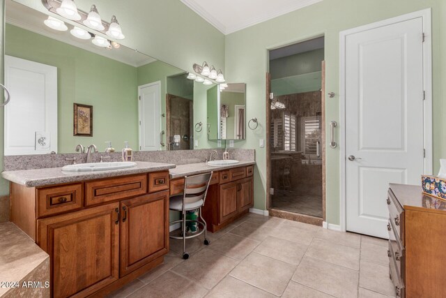 bathroom with crown molding, tile patterned flooring, vanity, and a shower with shower door