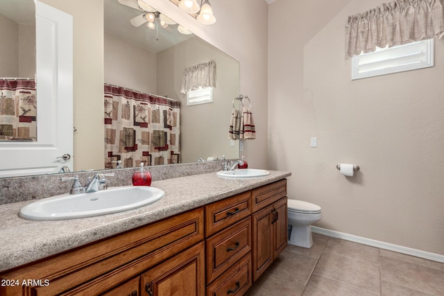 bathroom featuring toilet, vanity, tile patterned floors, and walk in shower