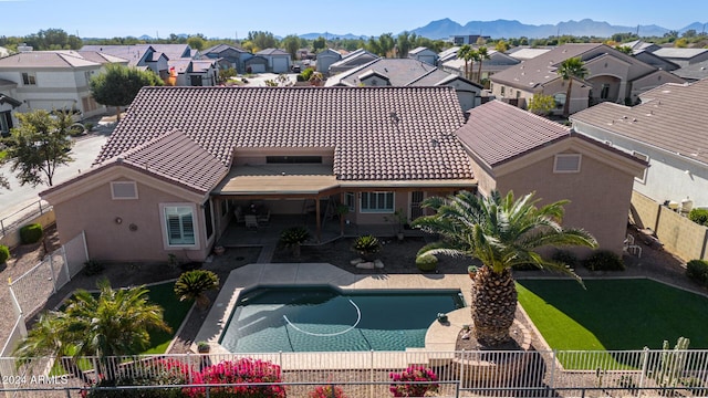 exterior space with a mountain view and a patio area