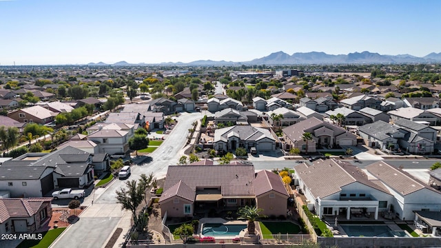 birds eye view of property featuring a mountain view