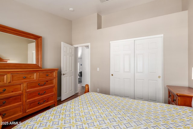 bedroom with a closet and visible vents