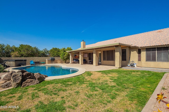 view of pool with a patio, a lawn, fence private yard, and a fenced in pool