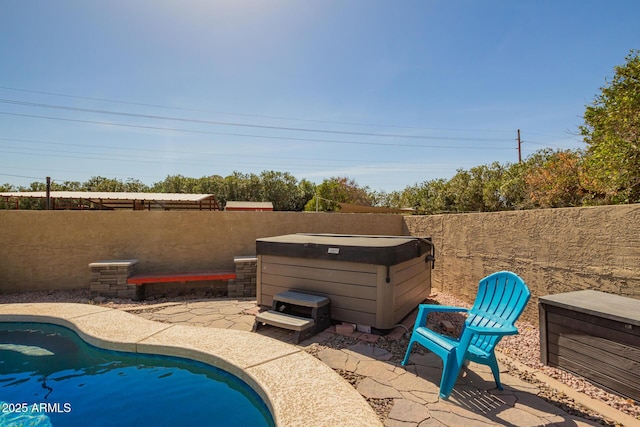 view of swimming pool featuring a fenced in pool, a patio area, a hot tub, and a fenced backyard