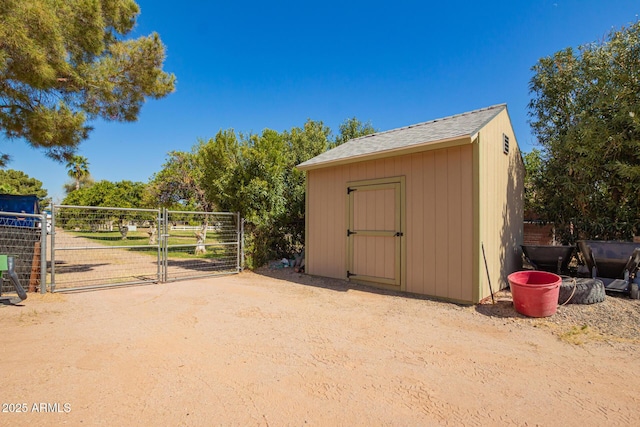 view of shed featuring a gate