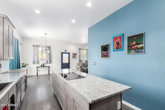 kitchen with dishwasher, a kitchen island, dark wood-type flooring, black electric stovetop, and recessed lighting