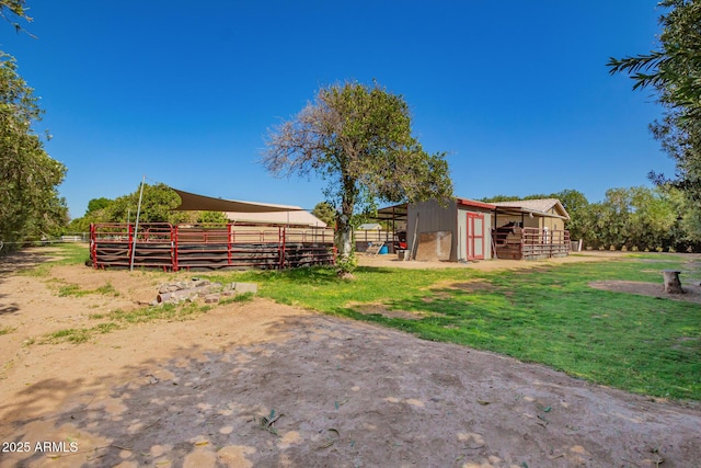 view of yard with an outbuilding and an exterior structure