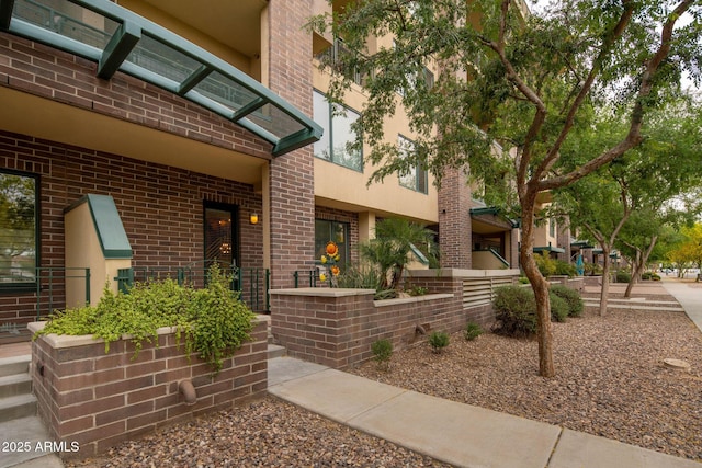 16 W Encanto Blvd Unit 22, Phoenix, AZ 85003 - property entrance featuring brick siding and stucco siding